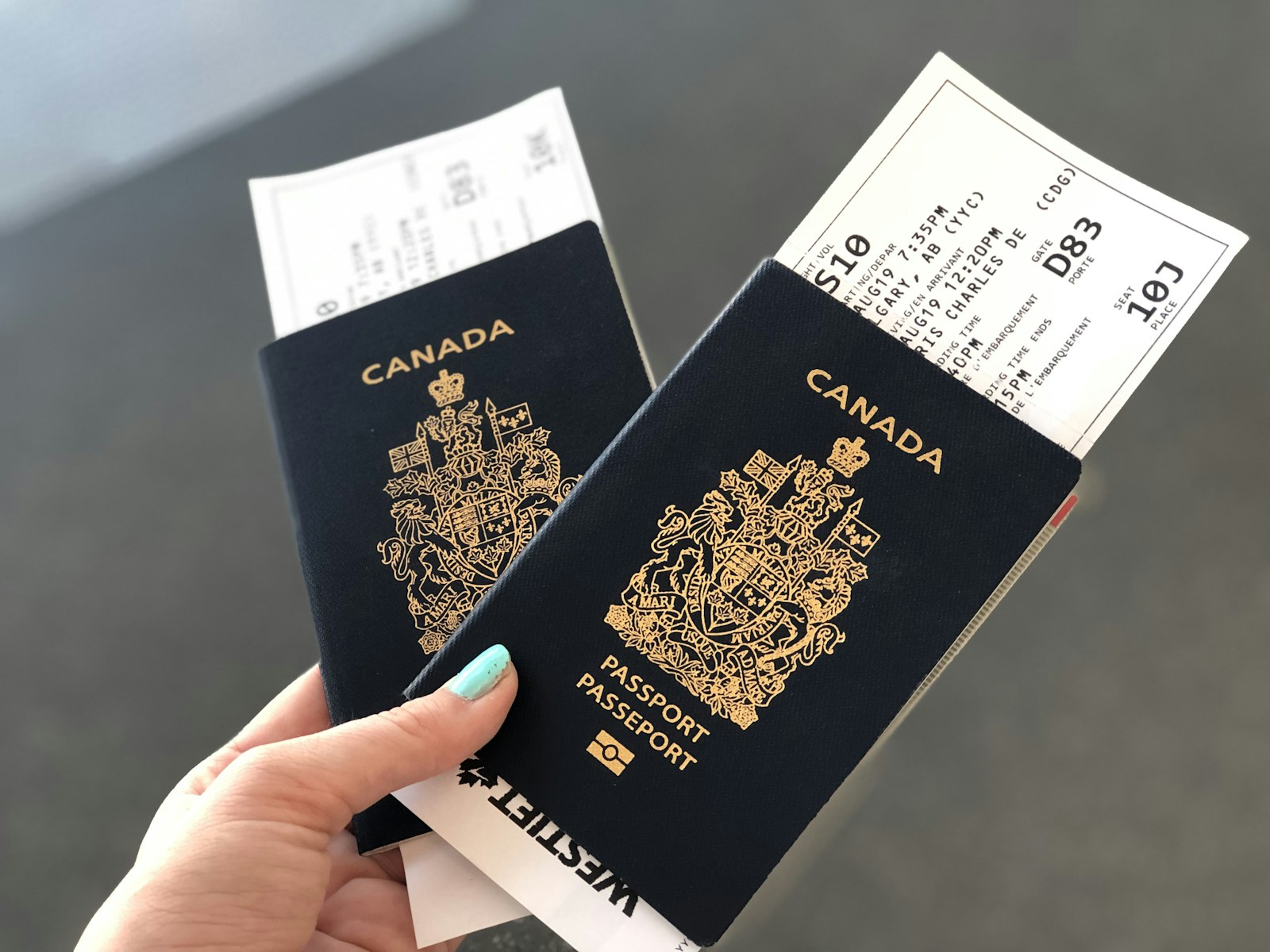 Canadian passports and boarding passes in hand