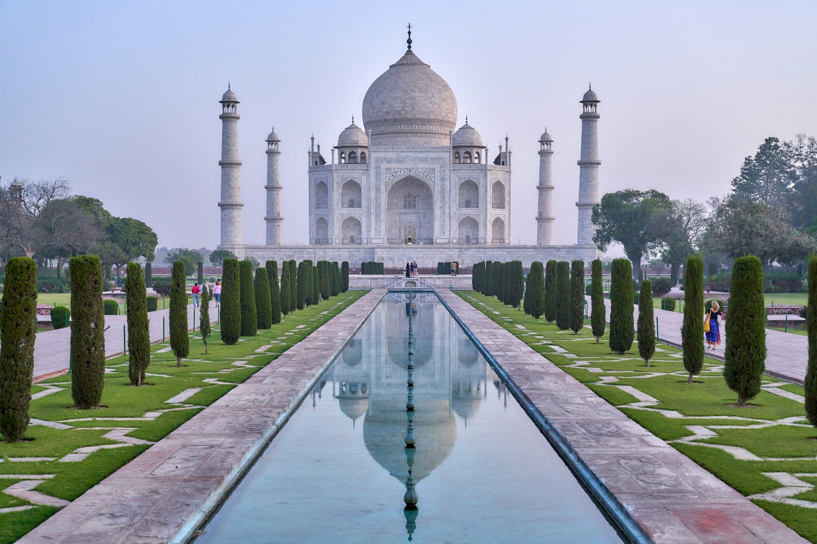 The Taj Mahal in India reflected in a water channel